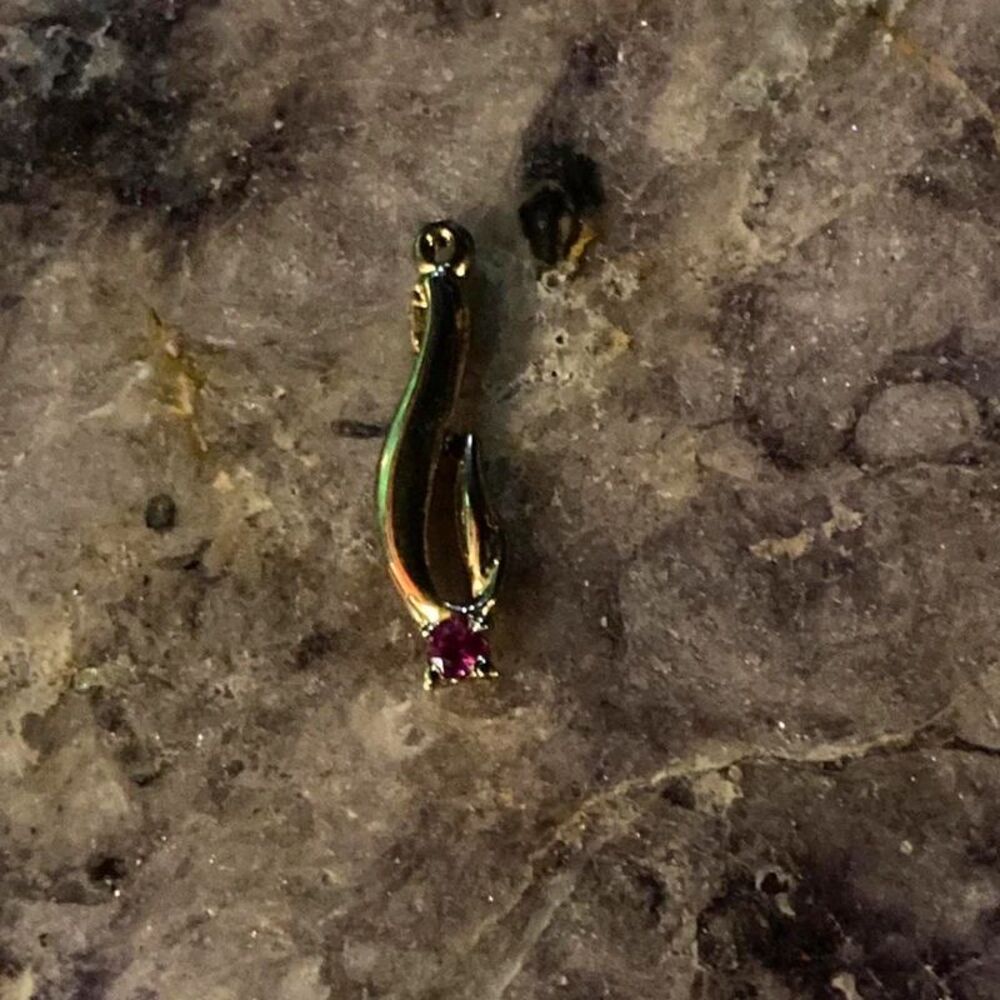 Sculptural gold charm pendant with pink sapphire